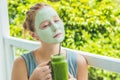 Spa Woman applying Facial green clay Mask. Beauty Treatments. Fr Royalty Free Stock Photo