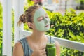 Spa Woman applying Facial green clay Mask. Beauty Treatments. Fr