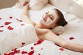 Spa Woman. Beautiful Woman Relaxes on Bed . Royalty Free Stock Photo