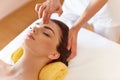 Spa Woman. Beautiful Young Woman Getting a Face Treatment at Beauty Salon. Face Massage Royalty Free Stock Photo