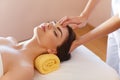 Spa Woman. Beautiful Young Woman Getting a Face Treatment at Beauty Salon. Face Massage Royalty Free Stock Photo