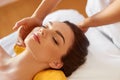 Spa Woman. Beautiful Young Woman Getting a Face Treatment at Beauty Salon. Face Massage Royalty Free Stock Photo