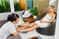 Spa Woman Body Care. Aromatherapy Leg Massage. Skincare Treatment Royalty Free Stock Photo
