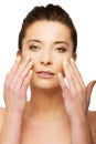 Spa woman with make up touching her face. Royalty Free Stock Photo