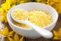 Spa with yellow herbal bath pearls and flowers Royalty Free Stock Photo