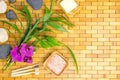 Spa, zen, massage concept. Bath salt, bamboo leaves, soap dish, toothbrush, white black stones, orchid Royalty Free Stock Photo