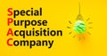 SPAC special purpose acquisition company symbol. Concept words SPAC special purpose acquisition company on beautiful yellow