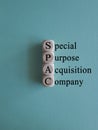 SPAC, special purpose acquisition company symbol. ?ubes with words \'SPAC\' on beautiful blue background