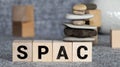 SPAC, special purpose acquisition company symbol. Wooden cubes with word 'SPAC'