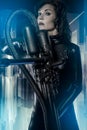 Space, armed woman in a garage, future concept, black latex with