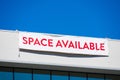 Space Available large banner on vacant commercial office building advertising the real estate, property, office for sale, rent or Royalty Free Stock Photo