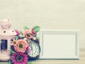 space background of photo frame and candle light and alarm clock and artificial flower Royalty Free Stock Photo