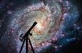 Space background with silhouette of telescope. Messier 83 Royalty Free Stock Photo