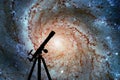 Space background with silhouette of telescope. Pinwheel Galaxy Royalty Free Stock Photo