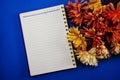 Space copy empty notebook with artificial flower background Royalty Free Stock Photo