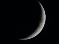 Moon, crescent on dark sky.