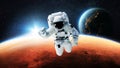 Space man astronaut flies in open space near red planet Mars with blue planet Earth at sunset. High quality space wallpapers. New Royalty Free Stock Photo