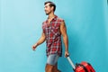 Trip man happy vacation traveler baggage weekend guy travel flight journey background suitcase studio Royalty Free Stock Photo