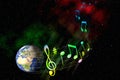 Space music background. Planet Earth in space. The globe flying in outer space, carried away by a musical stave Royalty Free Stock Photo