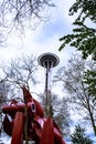 Space needle with Olympic Iliad sculpture Royalty Free Stock Photo
