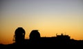 Space observatories at sunrise on top of Haleakala crater on Maui.