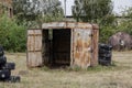 Space for playing paintball with the paint marks after fights. Abandoned paintball playground with barricades made of old tires