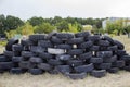 Space for playing paintball with the paint marks after fights. Abandoned paintball playground with barricades made of old tires Royalty Free Stock Photo