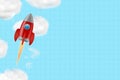 Space rocket, in the blue cloudy sky. Copy space. Place for text. The concept of the new school year. Education.