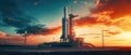 space rocket on launch pad, panoramic shot of the sky and the setting sun in the background Royalty Free Stock Photo