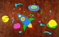 Space rocket and planets, solar system, Astronautics and space alien on wooden background-application made by child