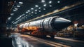 Space rocket in warehouse of factory, large hangar of modern plant. Concept of industry, technology, manufacturing, science,