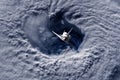 Space ship shuttle flying near earth from the hurricane and massive clouds in atmosphere, image made of NASA photos f