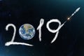 Space shuttle rocket in leaves a trail 2019 to the planet Earth. The concept of a scientific New Year in the World - North and