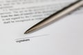 Space for signature on document and silver pen Royalty Free Stock Photo