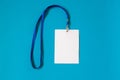 Empty ID card badge icon with blue belt, on blue background. Royalty Free Stock Photo