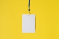 Empty ID card badge icon with blue belt, on yellow background. Royalty Free Stock Photo