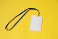 Empty ID card badge icon with blue belt, on yellow background. Royalty Free Stock Photo