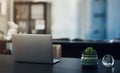 A space to get productive. Still life shot of a laptop on a table in an office. Royalty Free Stock Photo