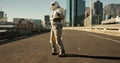 Space, travel and astronaut in city with dance, future dystopia and planet for discovery. Earth, aerospace mission and