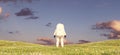 Spaceman Astronaut Standing on a Green Grass Meadow Hill Landscape Pink Spring Sunset Rear View Royalty Free Stock Photo