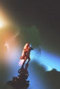 Spaceman with red jetpack rocket standing against starry sky