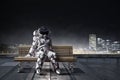 Rocketman on bench. Mixed media Royalty Free Stock Photo