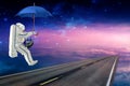 Spaceman on the umbrella and Earth traveling Royalty Free Stock Photo