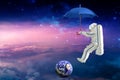 Spaceman on the umbrella traveling Royalty Free Stock Photo