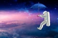 Spaceman on the umbrella traveling witch space mission