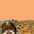 Spaceman walks on the planet Mars. The elements of this image furnished by NASA