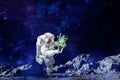 Spaceman witch pure energy space growing plants Royalty Free Stock Photo