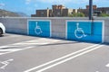 Spaces to park cars for disabled people in a public parking lot Royalty Free Stock Photo