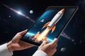 Spaceship blasting off from tablet screen. Digital rocket launch. Futuristic space exploration concept.