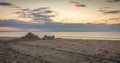 Spaceship sandcastle at beautiful sunrise Royalty Free Stock Photo